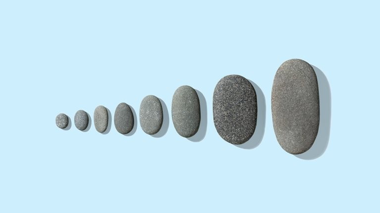 Gray pebbles neatly arranged from small to large