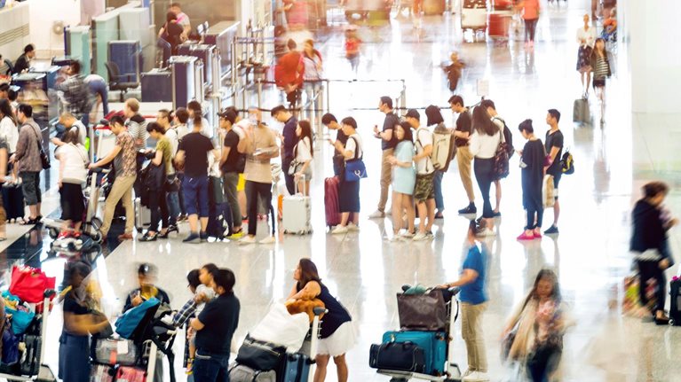Crowd of people waiting for check-in - stock photo